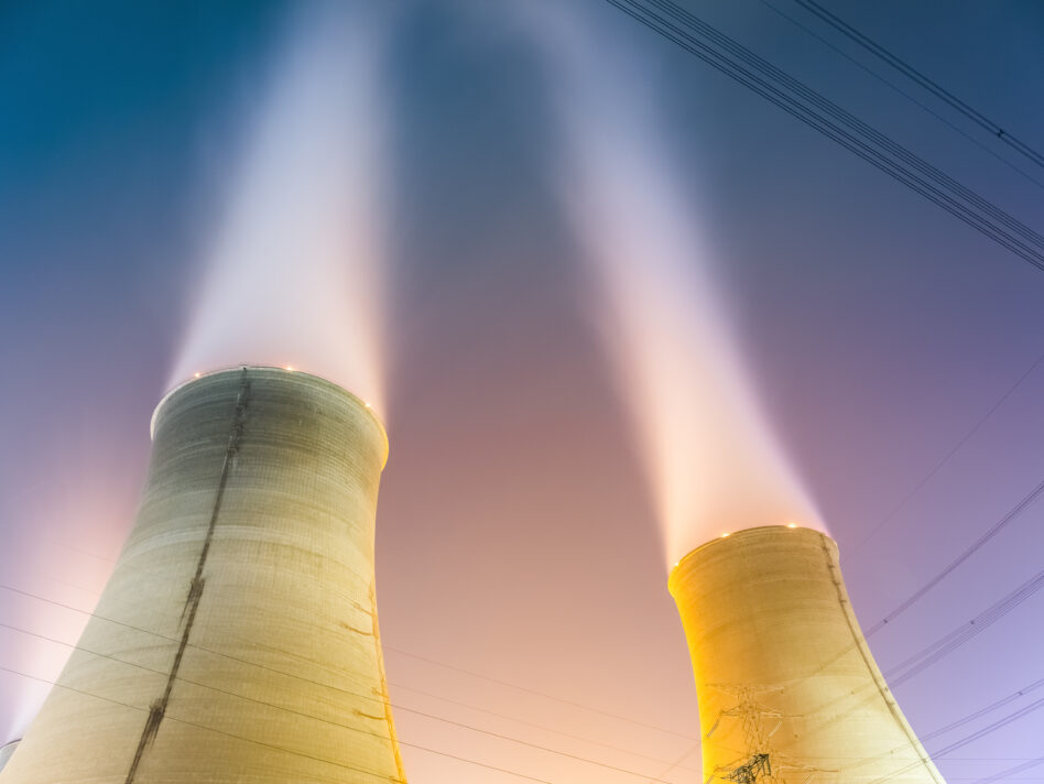 the cooling towers at night of the nuclear power generation plant