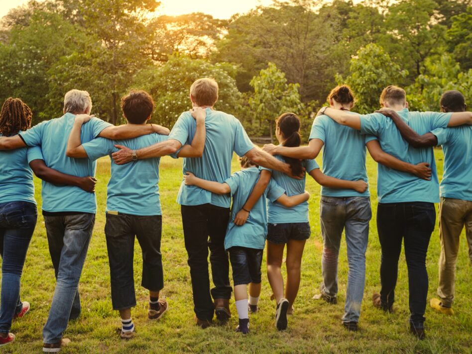 Volunteers holding around each other