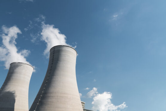 cooling tower closeup, power plant and blue sky background