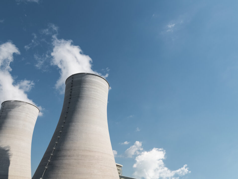 cooling tower closeup, power plant and blue sky background