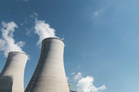 cooling tower closeup, power plant and blue sky background